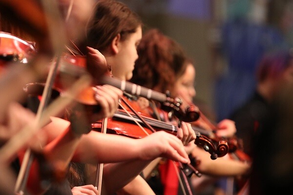 image of kids playing fiddles