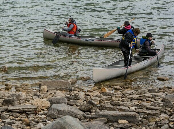 people in canoes