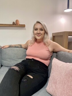 photo of Katie sitting on a sofa